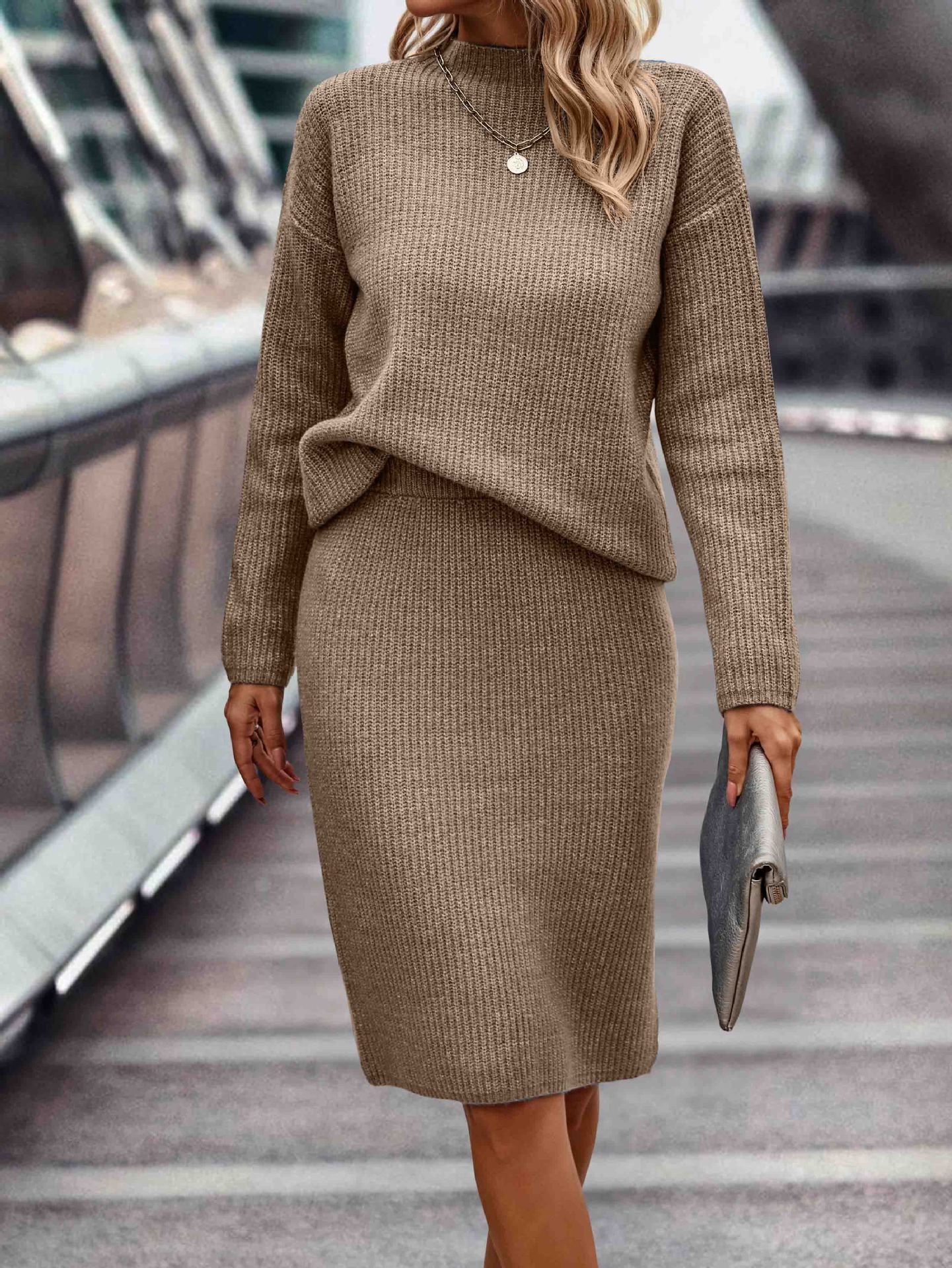 Elegant seasonal ensemble featuring a sleek, long-sleeved knit top with a high neckline, paired with coordinating bottoms for women.